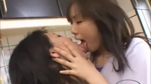 Mature-asian-woman-kissing-and-spitting-sucking-tongues-with-a-girl-in-the-